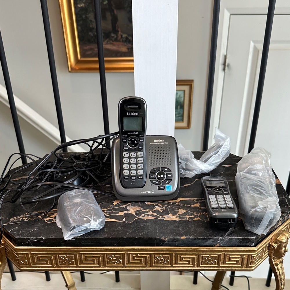 Uniden Cordless Phone with Digital Answering System What’s on Table is included